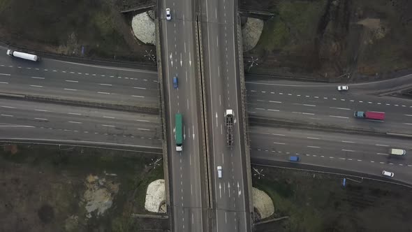 Aerial View of Road Junction with Fast Moving Cars