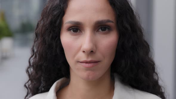 Close Up Head Shot Portrait Outdoors 30s Beautiful Calm Serious Sad Upset Woman Look at Camera