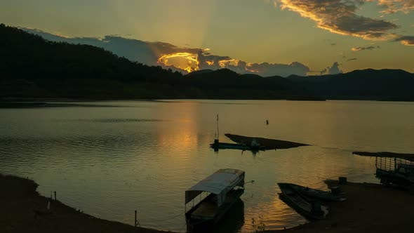 Boat on Lake With Sunrise