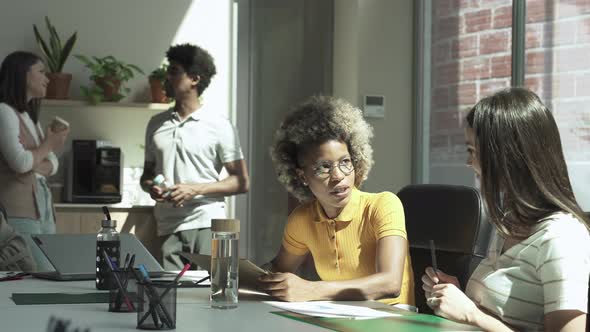 African American and Caucasian Female Colleagues Working Together Creative Multi Ethnic Business