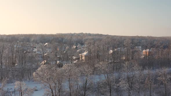 Winter country landscape with timber fence and snowy road. 