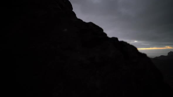 Coastline And Mountains Under Cloudy Sky At Sunrise