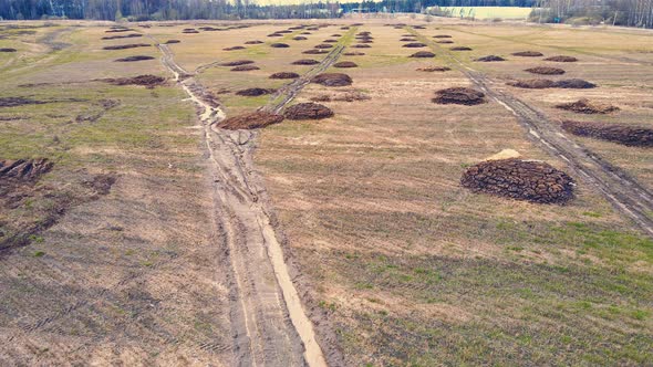 Round Heaps of Manure on an Agricultural Field Aerial View