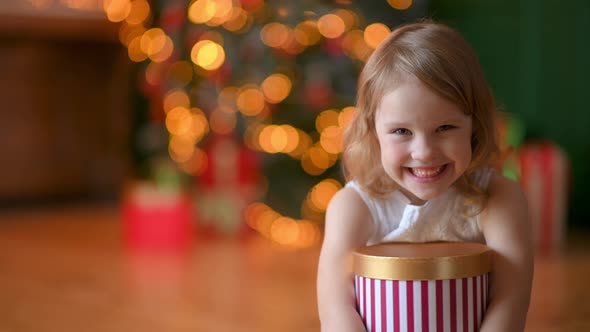 portrait of Happy Cute Girl with a gift