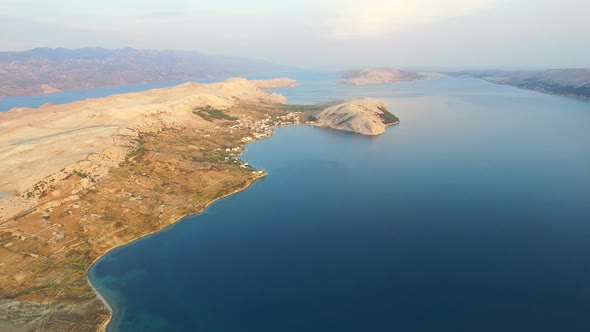 Flying above barren landscape of Pag island