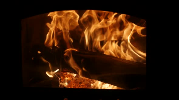 Fireplace Full of Firewood and Fire