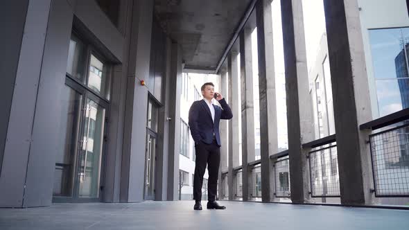 portrait successful young confident businessman talking background modern