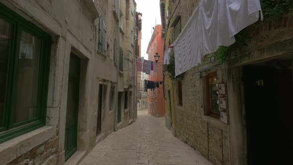 Clothes hung on a narrow street