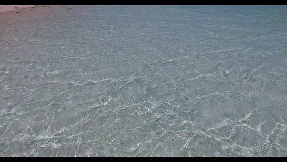 Aerial top down texture of tropical bay beach adventure by turquoise water with white sandy backgrou