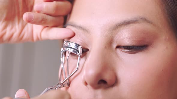 Young asian woman in bedroom. Make-up artist in beauty studio