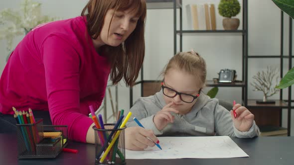 Little Girl with Genetic Disease Drawing with Felt Tip Pen