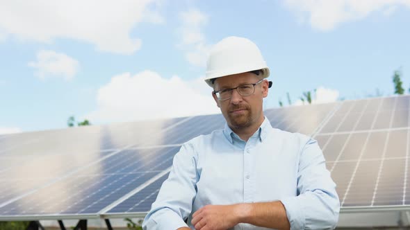 Portrait of Confident Engineer of Solar Cell Farm Industry