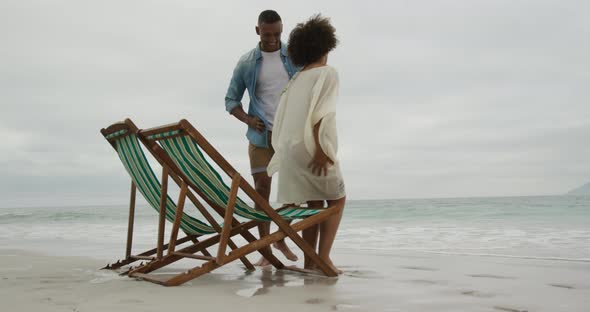 Couple enjoying free time by the sea