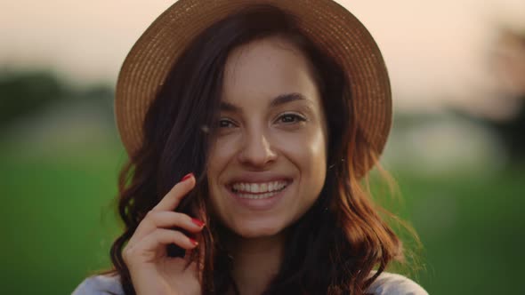 Portrait of Playful Lady Smiling Outdoors. Young Woman Looking Camera