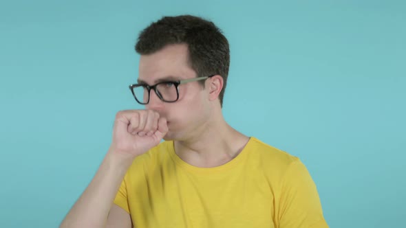 Man Pointing at Camera, Blue Background