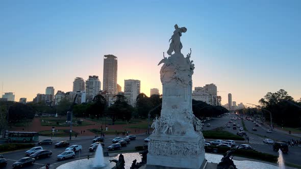 Aerial slow pull out shot capturing monumental sculpture Carta Magna and Four Regions of Argentina a