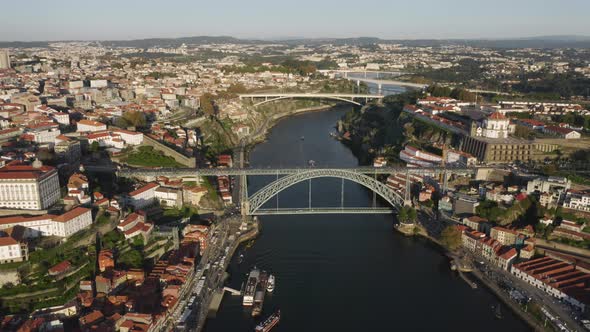 Aerial Footage of the City with Bridges Across the Winding River