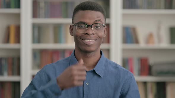 Young African Man Showing Thumbs Up Sign