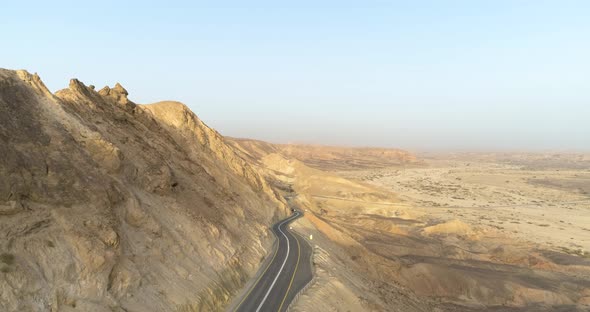 Aerial view of a winding road on a mountain side in the desert. Negev, Israel