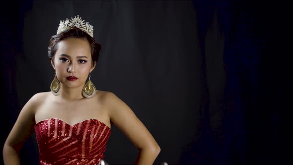 Beauty pageant winner looks at the camera as she wears her royal, diamond jewel crown - copy space
