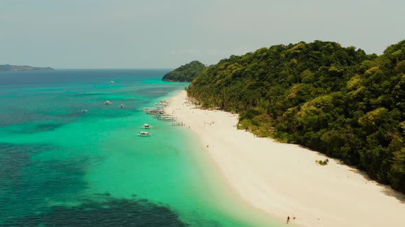 Tropical Beach and Turquoise Lagoon Water