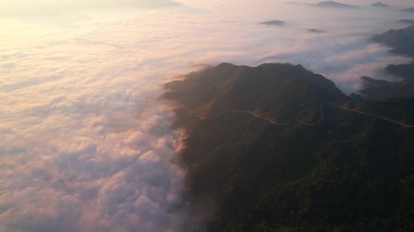 4K Aerial Flying Above Sea of Fog at Sunrise