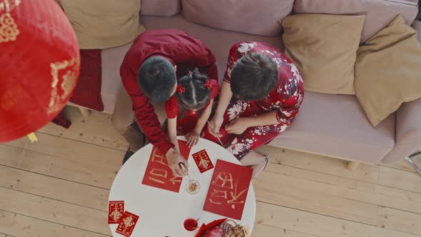 Top View of Chinese Family Making Decorations