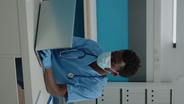 Vertical Video Portrait of Man with Nurse Profession Wearing Uniform