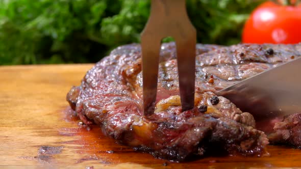 Chef Cuts the Finished Juicy Beef Steak