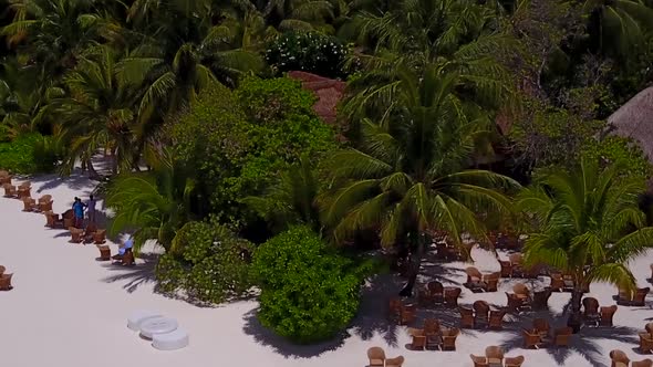 Aerial drone scenery of bay beach by clear ocean with sand background