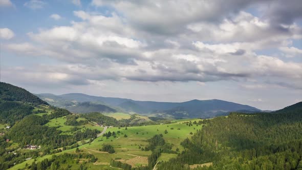 Aerial Clouds Motion over Green Forest Landscape