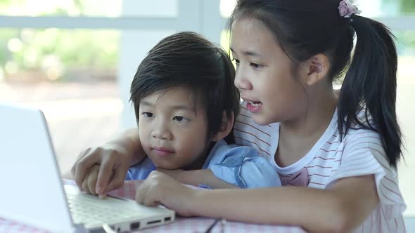 Cute Asian Children Using Tablet Together Slow Motion