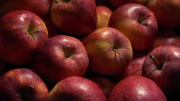 Passing Over Pile Of Red Apples