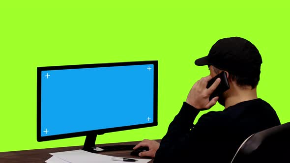 A Male Looking at Blue Screen Monitor, Chroma Key