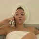 Amazed Emotional Mixed Race Lady with Tattoo Talks on Phone - VideoHive Item for Sale