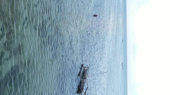 Tanzania Vertical Video  Boat Boats in the Ocean Near the Coast of Zanzibar Aerial View