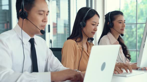 Business People Wearing Headset Working Actively in Office