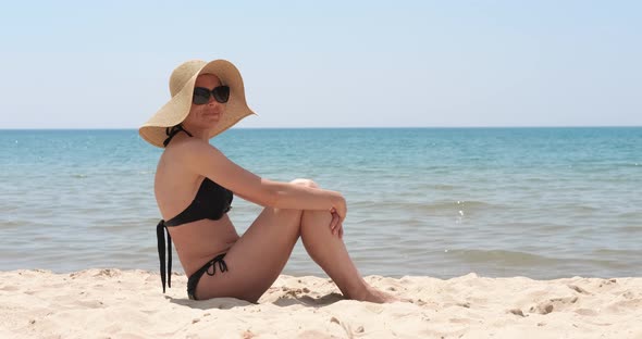 Girl Lay on Sandy Shore