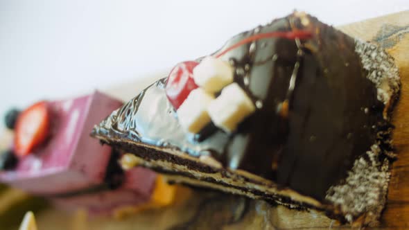 Pieces of Different Cakes on a Retrostyle Baking Tray