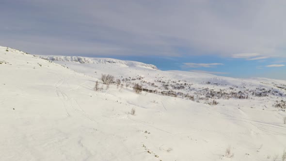 Mountain Summit And Snowy Landscape View In Norway -  aerial shot