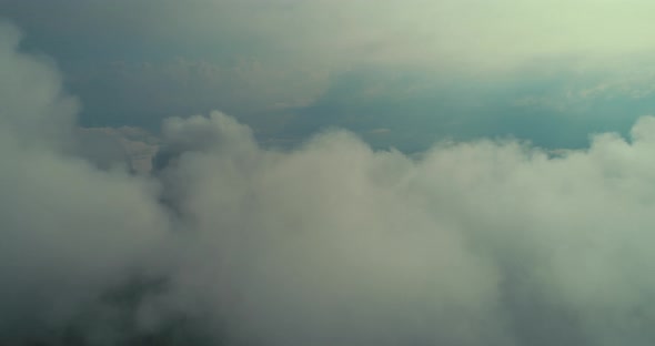 Aerial Fly Above Clouds with Blue Sky in Backgroubnd on Beautiful Sunny Day