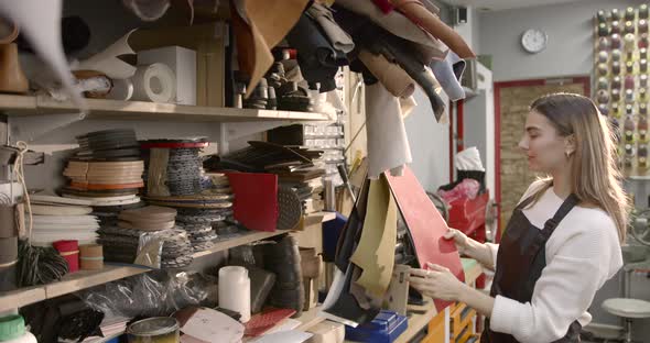 Woman Making Selection From Fabric in a Shop