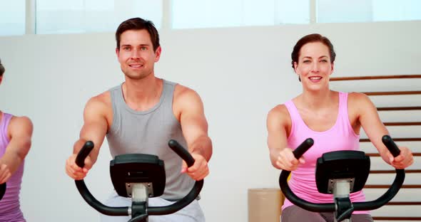 Happy Diverse Fitness Group doing a Spinning Class