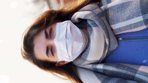 Woman Wearing Protective Medical Mask in Winter