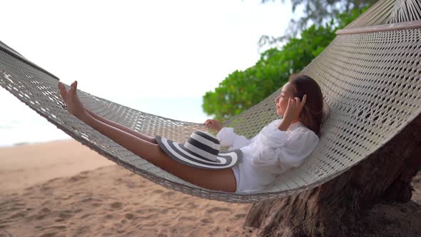 Asian woman enjoy around beautiful beach sea ocean