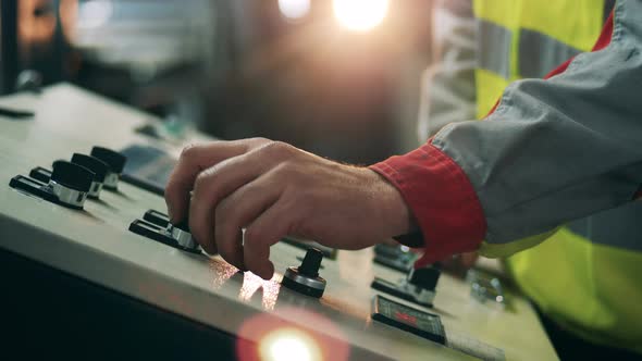 Factory Console Is Getting Operated By a Male Worker