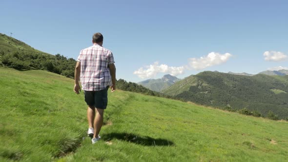Back View of Young Man Hiking in Mountain Outdoor Nature Scenery During Sunny Summer Day Gimbal