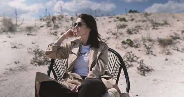 Portrait of Woman relax on the seaside at the sandy ocean beach. Sense of balance and calmness.