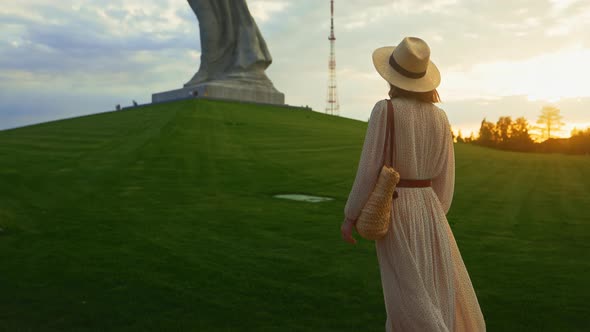 An attractive woman on the Mamayev Kurgan at sunset