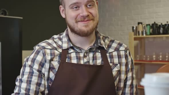 Barista Giving Coffee to Client